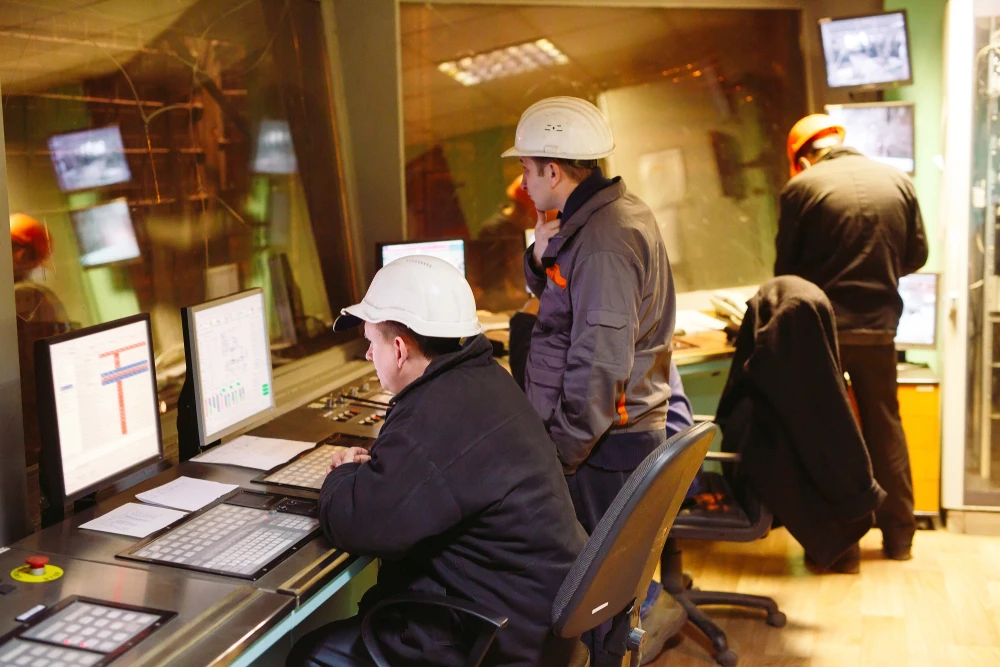 Power plant workers overseeing controls